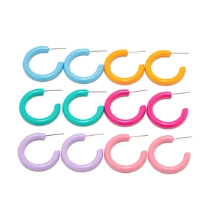 Set of 12 colorful C-shaped enamel hoop earrings in vibrant resin on white background