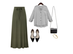 Flat lay of olive green high waist knit midi skirt paired with striped shirt and bag