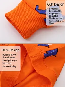 Kids orange crewneck sweatshirt featuring ribbed cuffs and a blue cartoon animal print