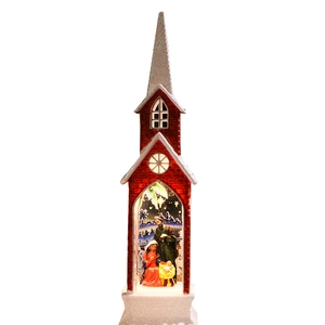 Lighted red Christmas church decoration with a nativity scene and silver glittered spire