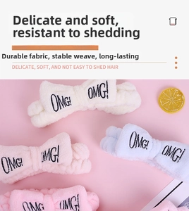 Detail of coral fleece headband with OMG embroidery and soft bow in macaron colors