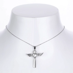 Detail of S925 sterling silver heart cross pendant with sparkling white zircons