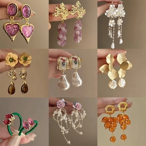 Set of vintage-style crystal pearl drop earrings in various floral and heart designs