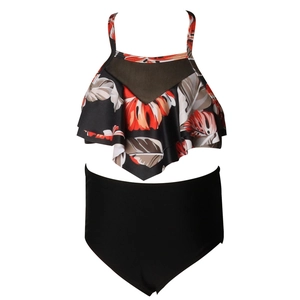 Detail of high-waisted tankini set with tropical leaf print and mesh splice neck