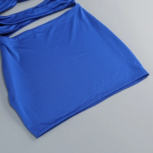 Detailed view of the blue hollow-out cross design with glossy elastic fabric texture