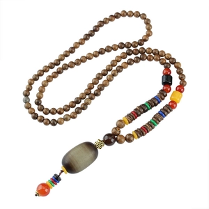 Vintage wooden prayer bead necklace with colorful spacers and horn style pendant