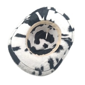 Close-up of fluffy cow print cowboy hat showing soft faux fur and inner polyester label