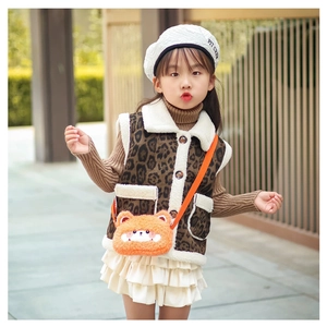 Detail of plush orange bear crossbody bag with leopard print vest for girls' winter style