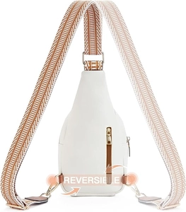 White crossbody chest bag featuring a reversible patterned strap and smooth leather finish
