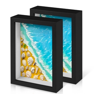 Set of two black 3D shadow box frames with ocean beach shells and resin wave textures