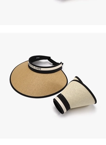 Detail of foldable straw sun visor showing both expanded and rolled-up portable states