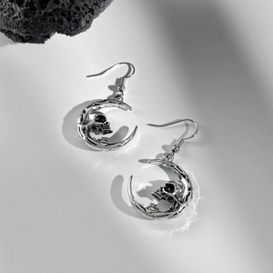 Gothic silver moon and skull earrings with butterfly detail in vintage metal finish