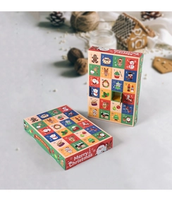 Detailed view of a 24-day Christmas advent calendar box with festive holiday decorations