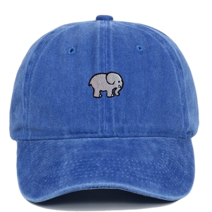 Close-up of elephant embroidery on blue washed cotton baseball cap with vintage texture