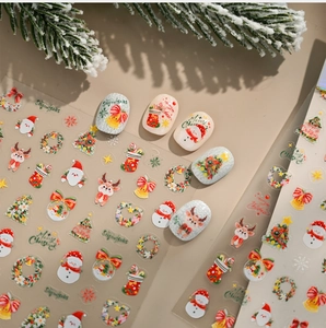 Detail of Christmas nail stickers with watercolor deer and snowman patterns