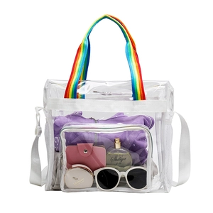 Transparent PVC tote bag with rainbow handles and shoulder strap showing large capacity