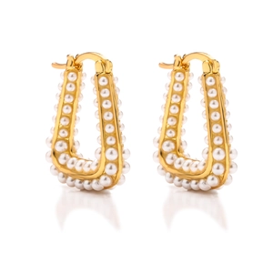 Elegant U-shaped gold hoop earrings with white pearls in a geometric minimalist design
