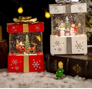 Close-up of festive Christmas snow globe lanterns with Santa and snowman scenes