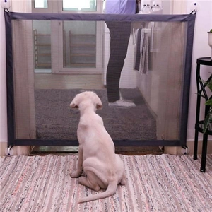 Portable pet safety gate with black nylon mesh and easy hook installation for doorways
