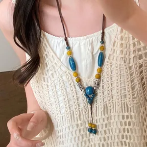 Collier double rang de style bohème avec perles en céramique bleues et cordon ciré