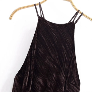 Women's dark brown sleeveless dress with diagonal pleats and tassel hem fringe detail