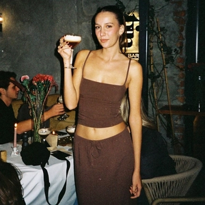 Close-up of slim-fit brown camisole and matching skirt two-piece set for women