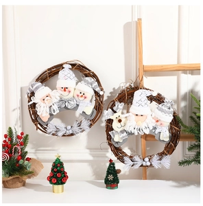 Detail of grey plush Christmas figurines on a natural rattan wreath for festive home decor