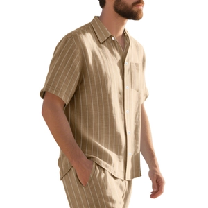 Detail of khaki striped short sleeve shirt set showing linen texture and button flap pocket