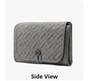 Detail view of the grey quilted diaper mat with an elegant round wooden button closure
