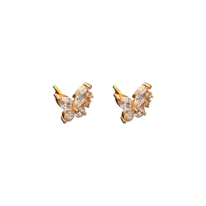 Elegant gold butterfly jewelry set featuring sparkling zircon crystals on a white background