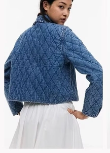 Detailed back view of vintage washed blue cropped diamond quilted denim bomber jacket