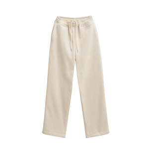 Detail of beige casual sweatpants featuring a drawstring elastic waistband and soft knit fabric