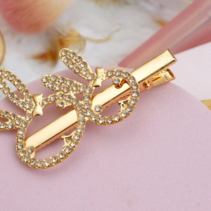 Barrette élégante en alliage doré avec strass blancs en forme d'oreille de lapin musicale