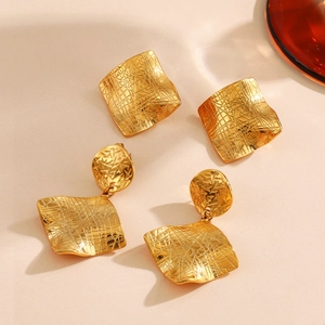 Irregular square titanium steel earrings with cross-hatch texture and 18K gold finish