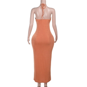 Detailed back view of orange halter neck backless maxi dress with ruffle lace-up details