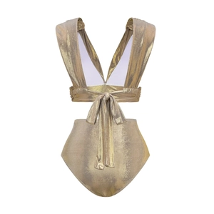 Detail of metallic gold swimsuit featuring deep V-neck and stylish back bow tie