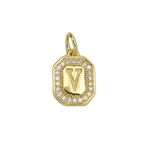 Macro shot of 18k gold plated octagonal pendant with letter V and micro-pave zircons