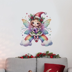 Detail of Christmas fairy wall sticker on a rainbow above a sofa in a cozy living room