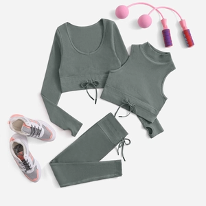 Three-piece yoga set with long sleeve top, halter vest, and high-waist leggings in sage green