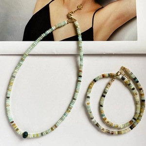 Matching set of green beaded necklace and bracelet with adjustable gold lobster clasps