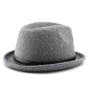 Macro detail of dark grey wool felt fedora featuring a slim black leather decorative band