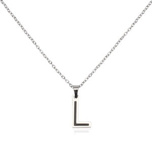 Detail of silver stainless steel letter L pendant necklace with black inlay on white background
