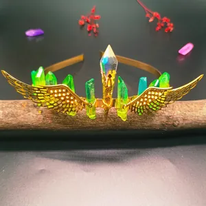 Detail of gold wings headband with green raw crystals and handmade wire wrapping