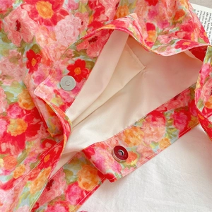 Detailed close-up of a floral tote bag with magnetic metal snap and fabric lining