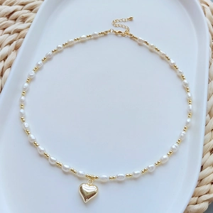 Natural freshwater pearl necklace with gold heart pendant and adjustable link chain