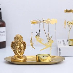 Golden rotating spinning candle holder with tray and flying angel cherub sculptures