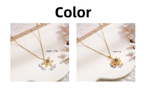 Detailed view of gold snowflake and sun pendants with unique 100 languages projection