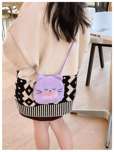 Rear view of a child wearing a purple plush cat crossbody bag with 3D ears and embroidery