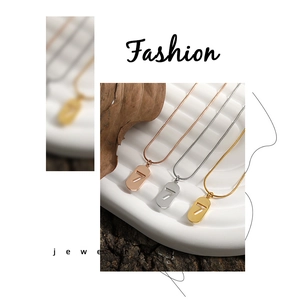 Detailed view of lucky number 7 pendant necklace in gold, silver, and rose gold finishes