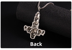 Macro back view of Mjolnir hammer pendant showing vintage texture and pearl chain